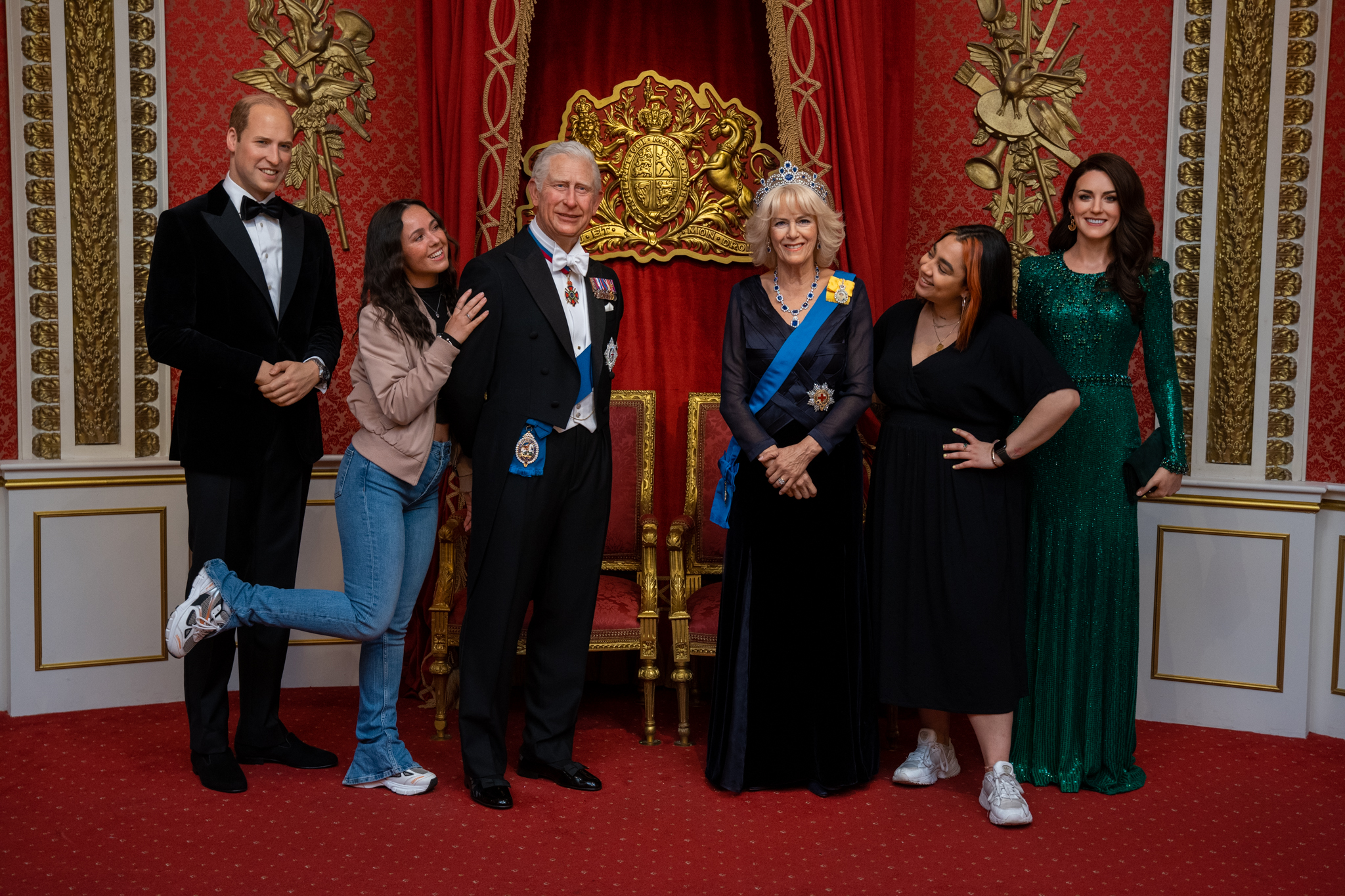 Friends enjoying the Royal Family figures at Madame Tussauds 